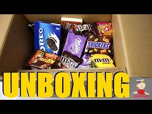 New a lot of candy man unboxing box full of sweets. Opening new candy box