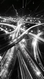 A visual representation of the interconnectedness of our world with intersecting light trails creating a complex and beautiful network. Black and white art