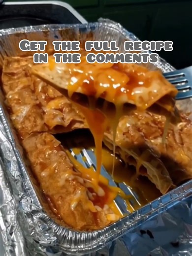 Soft corn tortillas, filled with sautéed onions and melted cheese, baked under a smoky red chile sauce… pure comfort on a plate. | Kiki's Kitchen