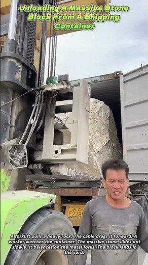 Unloading A Massive Stone Block From A Shipping Container