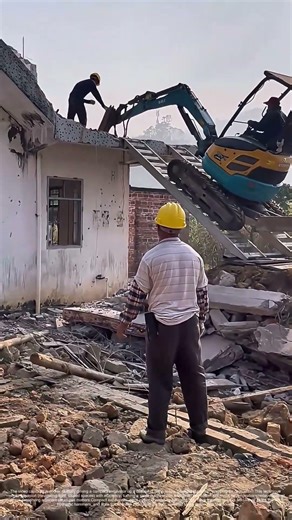 Scaling Demolition: How a Mini Excavator Conquers Rooftop Ruins