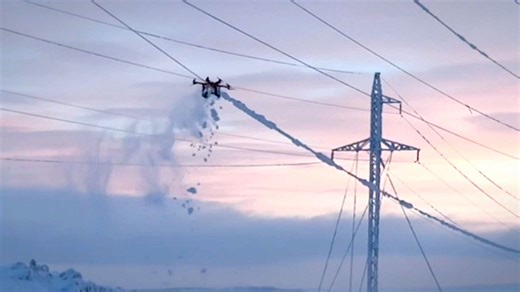 Arctic 'Spider' drone clear live power lines of frozen ice
