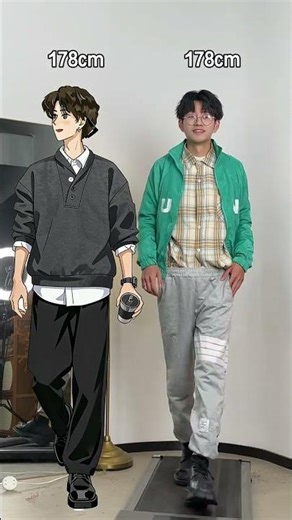 Little boy stop wearing oversize This dark gray Henry neck sweater black trousers is reall