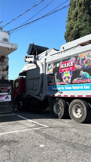 Ware disposal front loader dumping gas station trash