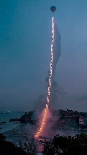 CATASTROPHE on Instagram: "“… the ladder rose toward the morning sun, carrying hope. For me, this not only means a return but also the start of a new journey.” In 2016, the Sky Ladder made its debut above Quanzhou, China, illuminating the sky for precisely two and a half minutes. This was the artist’s fourth and final effort, after previous attempts met with only partial achievements. The artist had envisioned a fiery ascent 21 years prior and was thrilled to witness his vision realized. — “... 