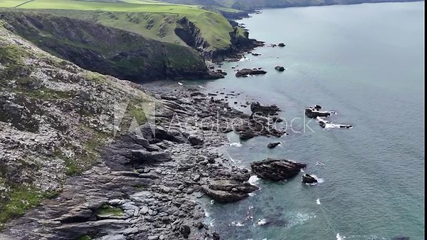 4K aerial footage of north cornwall coastline showing cliffs beaches rocks sea and surf