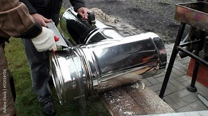 Installation of a wood stove. Installation of metal flue.
