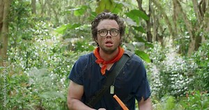 Scared man walking through jungle by himself - steady cam shot