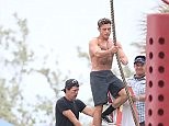 Zac Efron shows off body tanning up on set of Baywatch