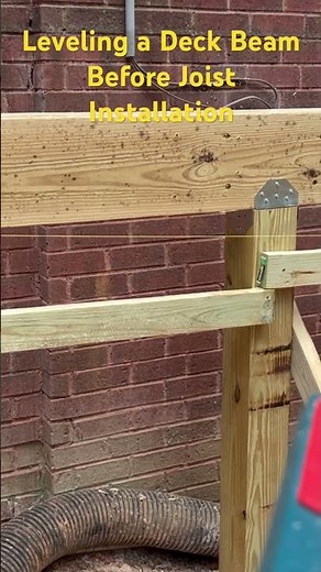 Using a rotary laser level to make sure the beam is perfectly level before installing the joists.