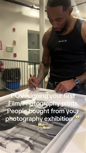 Signing My First Photography Prints at Exhibition