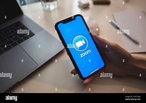 zoom video conference app logo on the smartphone screen Stock Photo - Alamy