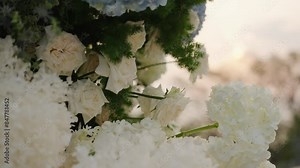 Decorative arch for the wedding ceremony Close-up of wedding arch decorated with flowers, roses, outside wedding ceremony.