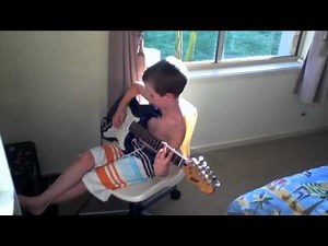 6 Year Old boy playing electric guitar