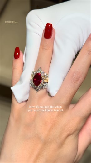 EARTHENA on Instagram: "A Statement That Feels Timeless, Powerful, And Unforgettable ❤️✨ Featuring The Gloria, 4ct Elongated Oval-Cut Ruby + Isabella Trio Set ruby engagement ring // oval ruby ring // ruby halo engagement ring // diamond wedding band stack // ruby bridal set // luxury ruby ring // statement engagement ring // Earthena Jewelry Beverly Hills #earthena #earthenajewelry #ruby #rubyrings #engagementring"