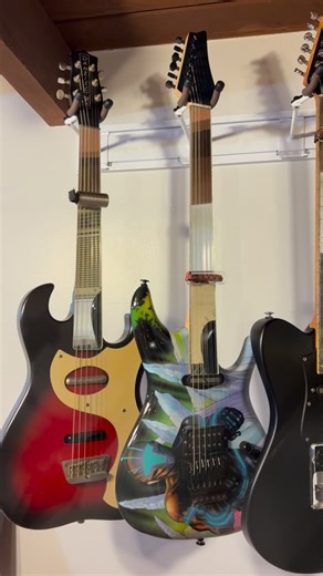 How do you hang your guitars? My Fretless glass guitars are swinging on new hangers courtesy of @stringswing | Ned Evett