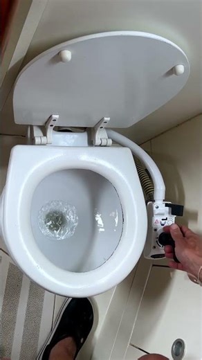 Sea toilet on a boat being filled with water and then pumped out