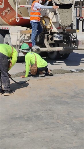 Road Construction Process: Pouring Concrete with Mixer Truck