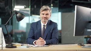 bearded man listen online seminar, meeting, conference or lecture, looking at camera remotely. Webcam view. Mature male worker businessman in suit on video call connection. sitting at work at a desk