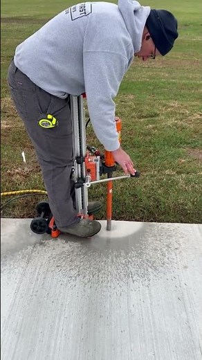 Drilling one of some 50+ holes for this safety pool fence install.
