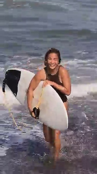 Stoked surfers enjoy fun, playful waves during an energetic Bali surf session