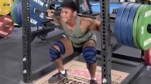 Fitness influencer Justyn Vicky doing squat-presses in the gym