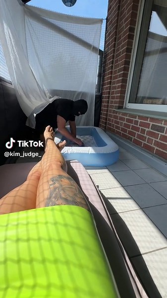Relaxing in Latex Dress by the Pool While Pool Boy Works