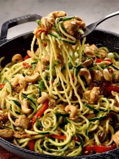 A delicious and healthy recipe for Zoodles with Chicken and Cashews, perfect for a quick meal. Ingredients 2 medium zucchinis, spiralized into noodles 1 pound boneless, skinless chicken breasts, cut into bite-sized pieces 1 tablespoon olive oil Full Recipe in First comment Enjoy ❤ 👇👇 | Olivia Recipes