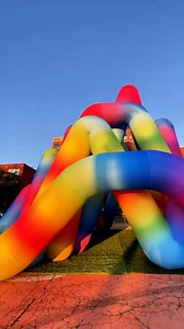 A rainbow portal has arrived! 🌈 ✨ Step into Pyramid Curbs by French Artist Cyril Lancelin, a temporary art installation in downtown Grand Rapids! 📍Located at 555 Monroe 🌀This piece is only here for two weeks only - don’t miss the magic! #michigan #grandrapidsmichigan | Downtown Grand Rapids Inc.