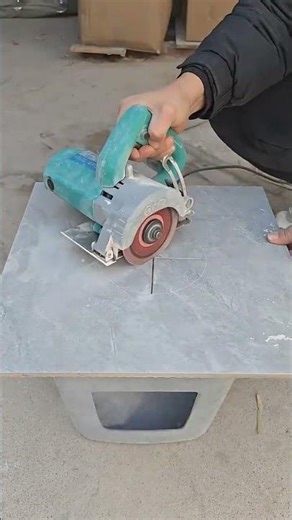 Using a compass to cut a round hole in a tile...