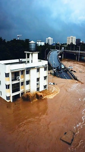 Building Collapses into River – floodwaters on streets #BuildingCollapse #BreakingNews #ExtremeWeather | Viral Clip
