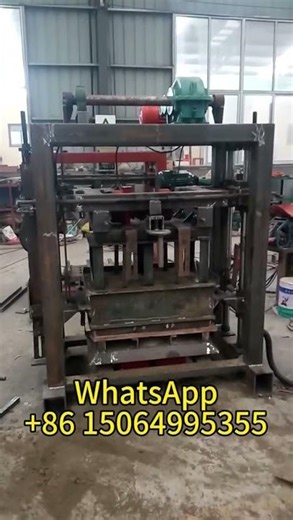 The QT40-2 is a small, manual, movable cement concrete block making machine.