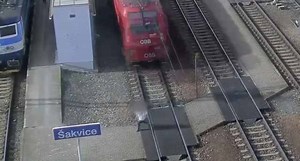 Damn: Woman On The Phone Gets Clipped By A Train After Crossing The Tracks!