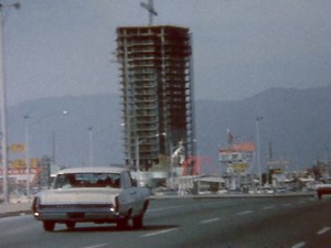 Las Vegas Strip, March 1964 Silent 8mm shot from a car window: Dunes tower under construction, Sammy at the Sands, "Fantasy on Ice," and a dog on a horse-drawn carriage. youtube.com/kenbutz | Vintage Las Vegas