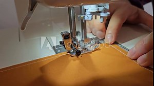 Patchwork quilt creation process - close up of the sewing machine during sewing. Needle fast movement. Stock Video