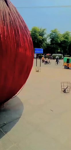 Exploring the Large Red Sphere in Outdoor Setting