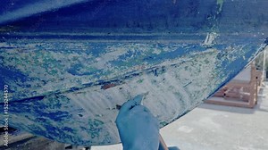 Antifouling scrap tool removing old paint boat hull to leave gelcoat clean