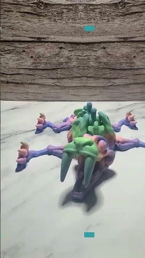 Articulated 3D Printed Saber-Toothed Tiger Skeleton: Rainbow Flexi Fidget Toy for Prehistoric Ent...