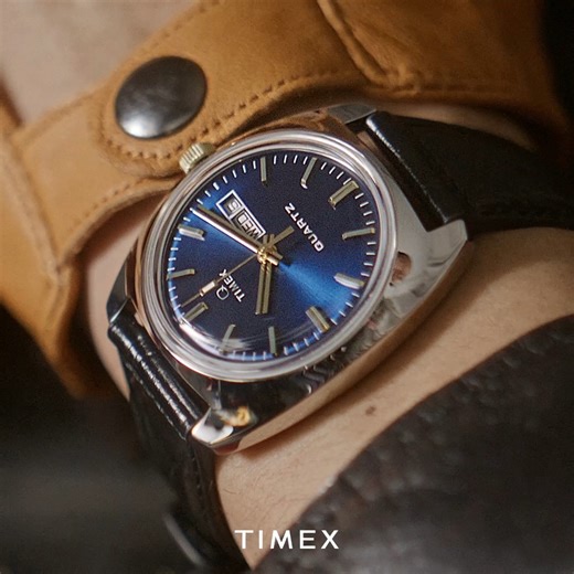 Meet the Q Timex 1978: vintage vibes with a modern twist. Housed in a 37mm recycled stainless-steel case, this retro-inspired beauty features a reliable quartz movement, hand-applied indices, and a throwback domed acrylic crystal. Gold-tone accents pop against the blue sunray dial, while the glossy black crocodile-patterned leather strap brings bold style. It’s a California-cool tribute to a game-changing era of watch design—classic, sleek, and effortlessly cool. Shop now at: https://tinyurl.com