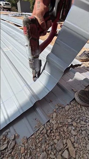 Cutting metal roofing panels with Milwaukee shears #construction #roofingconstruction #rooflife