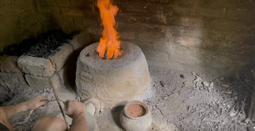 Making a wood ash-insulated furnace for smelting iron