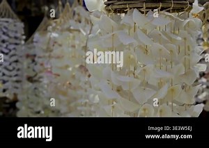 White capiz shell wind chimes sway. Gentle, calm, and natural texture display. Use for relaxation, travel Stock Video Footage - Alamy