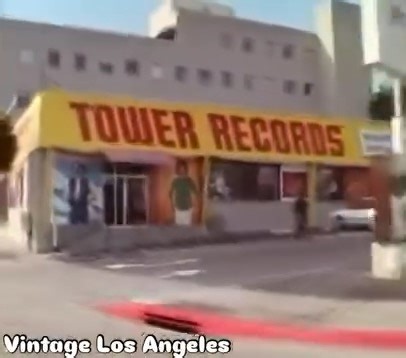 Sunset Strip in 1983 starting at Holloway heading west past Tower Records. I could totally be inside, but don’t see my mom’s car two toned Chevy Caprice. Although I DO see painted adds for Duran Duran’s RIO and Lionel Ritchie debut solo album. Thriller is on the lower half of the Marquee sign. As we keep driving you’ll also notice a poster for The Shining on the side of the Whisky A Go-Go, which was closed at this time for two years. Nice to see Gazarri’s and all that signage for KMET and Gil Tu