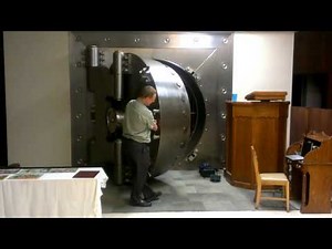 Closing a round bank vault door