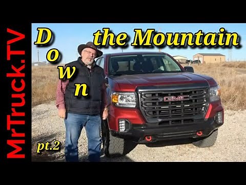 GMC Canyon 2022 AT4 down the snowy rocky mountain using Hill-Decent 4x4, tow-haul mode and brakes