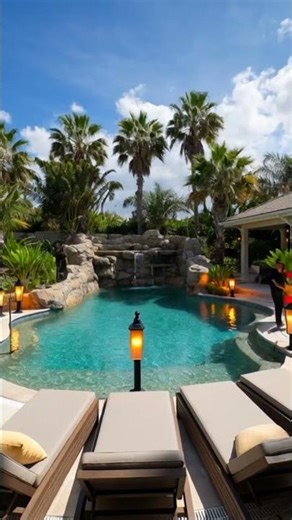 This tropical lagoon was designed to mimic an old Florida swimming hole.#insanepools #lucaslagoons