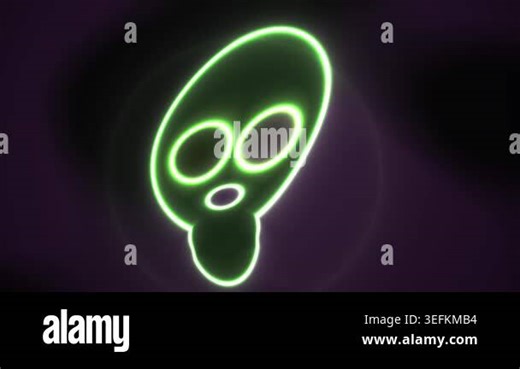 A neon green alien head sign glowing Stock Video Footage - Alamy