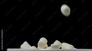 Pile of soft marshmallows falling. Sweet marshmallow falls from top to bottom.