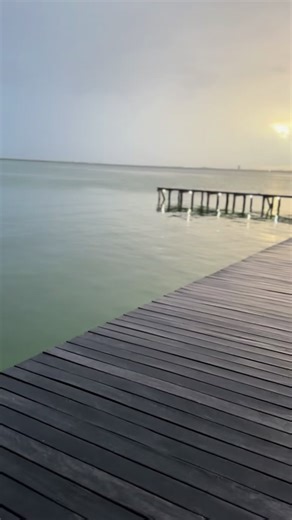Serene Walk on a Wooden Pier by the Water