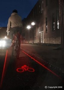 Bike-light that paints a laser-lit bike-lane on the road around you